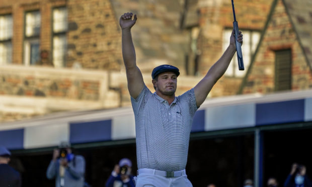 Bryson DeChambeau, of the United States, reacts after sinking a putt for par on the 18th hole to win the US Open Golf Championship.