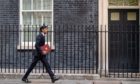 Chancellor of the Exchequer Rishi Sunak leaves No 11 Downing Street for the House of Commons to give MPs details of his winter economy plan.
