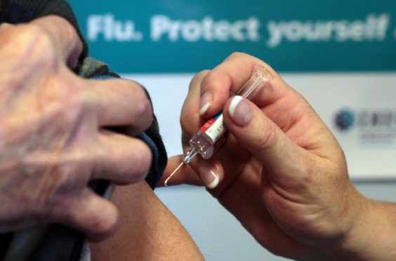 File photograph of a flu jab.