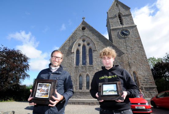 L-R: Reverend Will Stadler and Thomas Smalley outside Methlick Parish Church with some of the artwork.
Picture by Darrell Benns.
