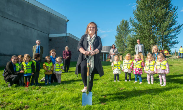 Sonya Warren, chairwoman of Moray Council's children and young people's committee, begins construction on the new nursery.