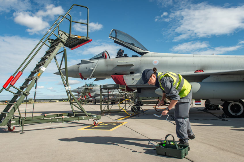 Crews perform checks on Typhoons that have arrived at Kinloss Barracks from Lithuania. Photos by Jason Hedges.