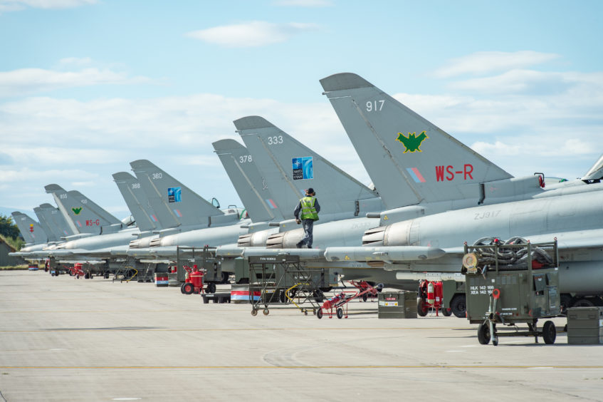 Crews perform checks on Typhoons that have arrived at Kinloss Barracks from Lithuania. Photos by Jason Hedges.