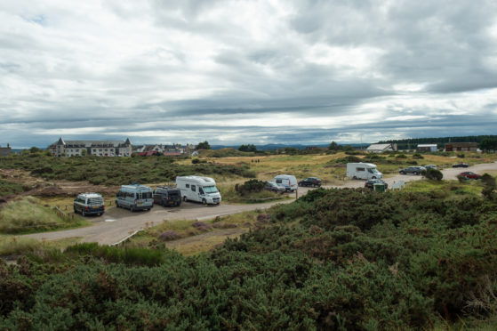 Vehicles at the beach car park in Findhorn.