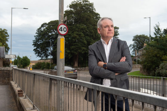 Moray MSP Richard Lochhead outside Alves Primary School. Photo by Jason Hedges.