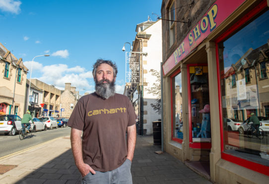 Andrew Birnie, who runs FP Birnie Pet Shop, on Elgin High Street believes the road closure has hit takings. Photo by Jason Hedges.