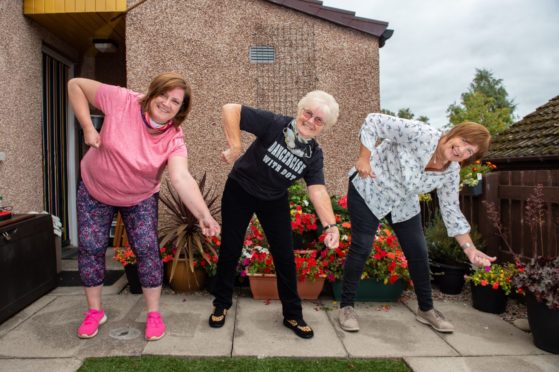 Dorothy Bremner has been joined in filming her online videos by  Ann Hay, assistant community development officer with Health and Social Care Moray, pictured left, and neighbour Phyllis Campbell.