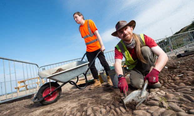 Archaeologists from Highland Archaeological Services Katie Roden and Lachlan McKeggie excavate the courtyard at the Portgordon ice house. Picture by Jason Hedges.
