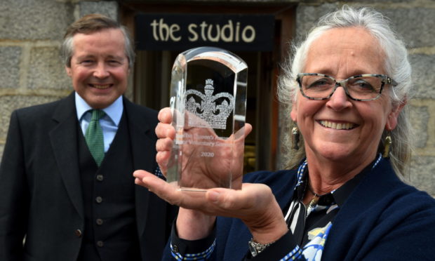 The Lord-Lieutenant of Aberdeenshire, Sandy Manson, presented the Queen's Award for Voluntary Service to North East Open Studios' Fiona Duckett.
