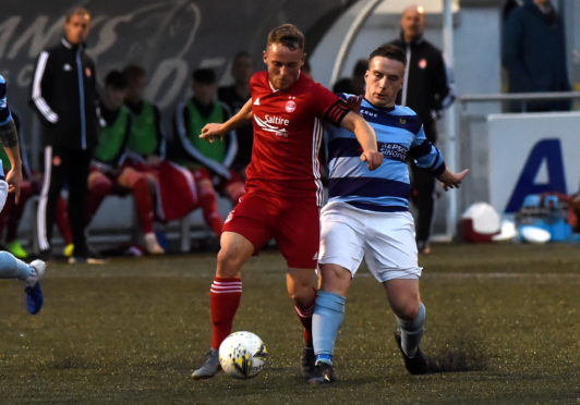 Seb Ross, left, in action for Aberdeen against Banks o' Dee's Jack Henderson.

Picture by KENNY ELRICK     21/08/2019