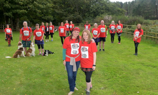 Suzanne McDonald and Louise Milner (front) with the group of walkers taking part.