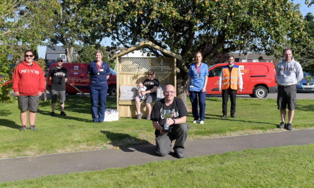 In the picture: Graham Watson, Mary Hay, Don Alexander, senior charge nurse Kay Duncan, Laura Dester with Logan 11 weeks old, staff nurse Klaudia Strzala, David Cruickshank and Doug Fraser.
Picture by Kath Flannery.