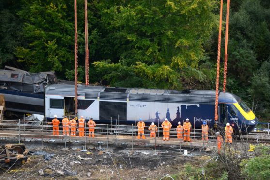 The first carriage  ( engine ) being removed  at the Stonehaven rail crash site.
A minutes silence was held prior to lifting the first carriage
Picture by Paul Glendell     10/09/2020