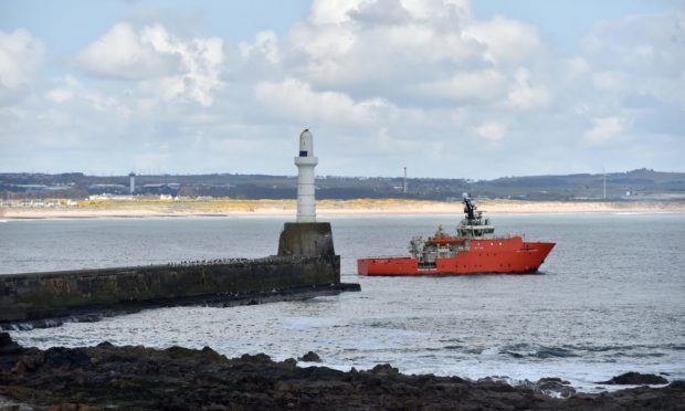 A boat leaves Aberdeen Harbour at Greyhope Bay. Picture by Scott Baxter