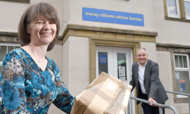 Sonya Hayward, fair delivery campaign coordinator for Moray Citizens Advice Bureau with Moray MSP Richard Lochhead as they launch their new campaign against unfair postal charges.