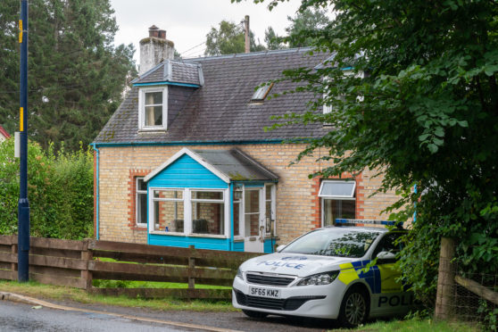 Police outside the house on Kingussie Road in Newtonmore