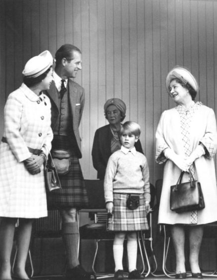 The Queen, Duke of Edinburgh, Prince Edward and the Queen Mother share a joke on their arrival at the Games in Braemar.