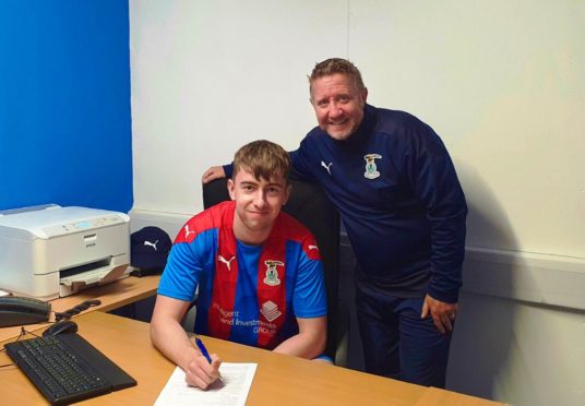 Ryan Fyffe with Caley Thistle manager John Robertson.