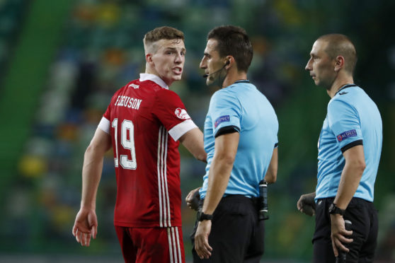 Aberdeen's Lewis Ferguson talks to the referee during the Sporting CP game