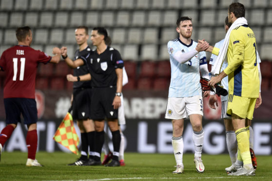 Scotland's Andrew Robertson and goalkeeper David Marshall (right) shake hands after the UEFA Nations League Group 2, League B match at Andruv Stadium, Olomouc.