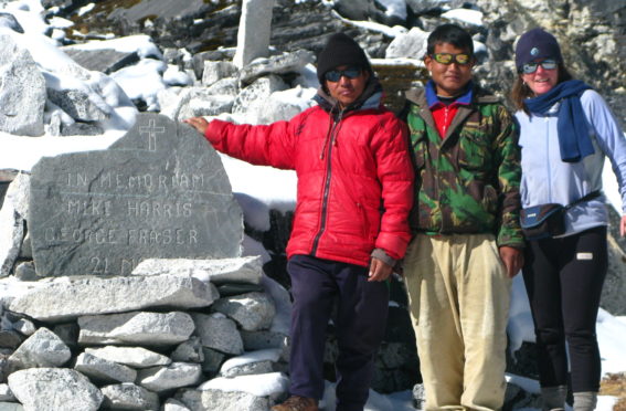 Sue Agnew, right, with the memorial cairn for her uncle, George Fraser, near his former base camp
