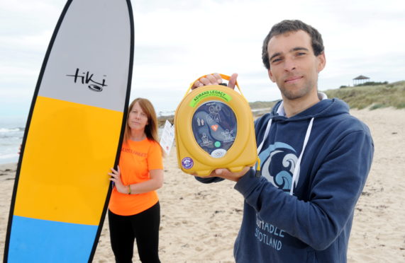 Sandra McKandie (from Keiran's Legacy) and Kev Anderson from Surfable Scotland at Hopeman Beach.
Picture by Darrell Benns.