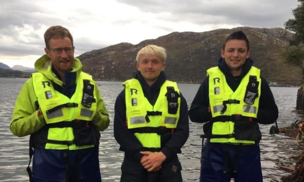 Marine operatives Tom Charles Edwards, Gregor Oliver and Joseph Finlayson helped rescue three kayakers in Loch Torridon in recent weeks.