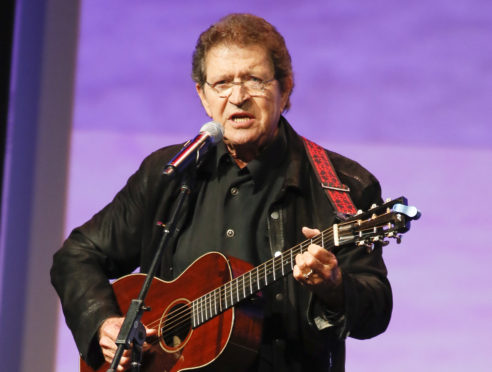 Mac Davis performs at the Texas Film Awards in Austin, Texas on March 6, 2014. Photo by Jack Plunkett/Invision/AP