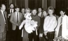 Magician Paul Daniels produces a cuddly toy for auction at the New Marcliffe Hotel, Aberdeen, in aid of charity in December, 1984. Among those looking on are Dons star Eric Black, third left.