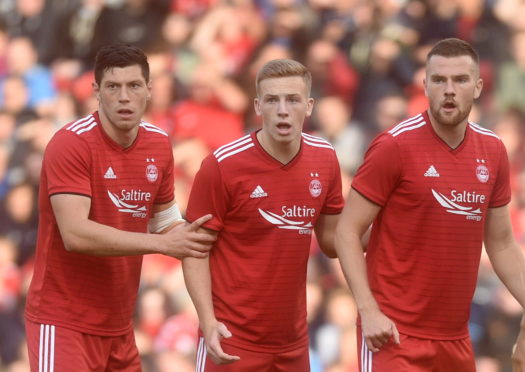 Scott McKenna, Lewis Ferguson and Mikey Devlin