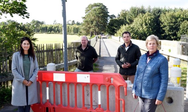 The Park Bride Action Group is calling for the crossing to be reinstated.
In the picture are from left: Lynn Coull, Kevin McPhee-Smith, Andrew Bowie MP and Anne Shearer. 
Picture by Jim Irvine  11-9-20