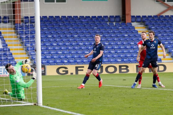 Marley Watkins watches his header beat Ross Laidlaw.