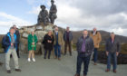 The mountaineer memorial with members of the Collie Mackenzie Heritage Group