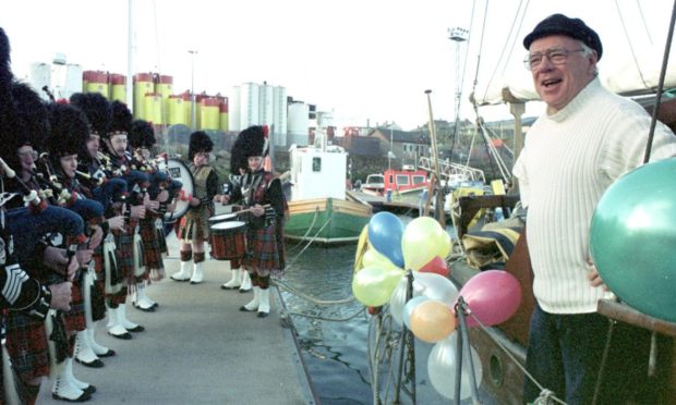 John Duncanson is surprised by pipers on his 60th birthday.