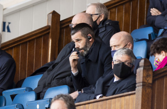 Ross County manager Stuart Kettlewell watches on from the stand against Rangers.