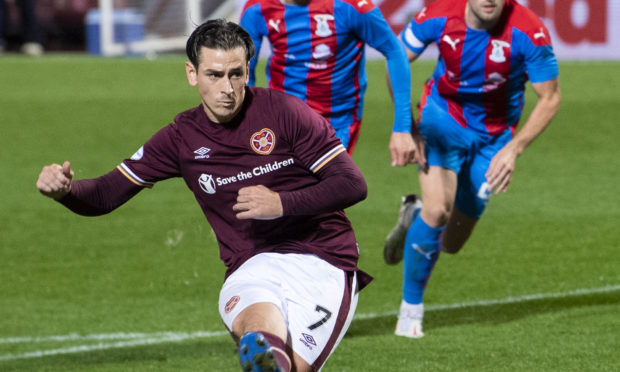 Hearts' Jamie Walker tucks home from the spot.