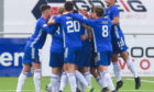 Cove Rangers players celebrate against Hibernian.