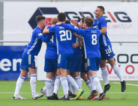 Cove Rangers players celebrate against Hibernian.