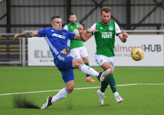 Cove Rangers defender Scott Ross in action against Hibernian.