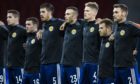 Aberdeen and Scotland defender Andy Considine, middle, and Motherwell's Declan Gallagher, second left.