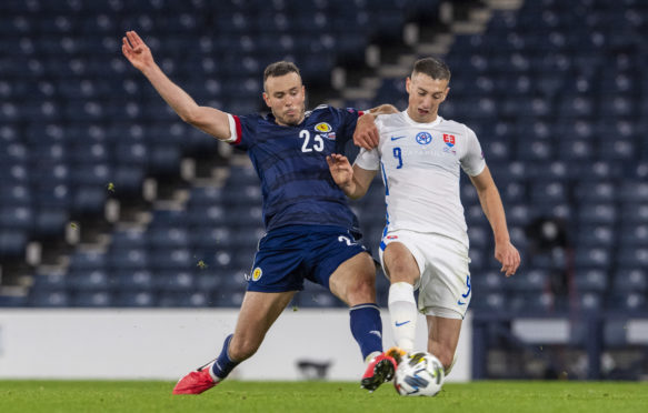 Scotland's Andy Considine (left) battles with Slovakia's Robert Bozenik.