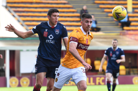 Ross County's Ross Stewart (L) in action with Declan Gallagher of Motherwell.