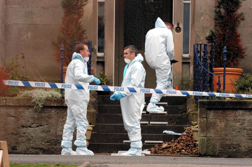 Forensic officers at the scene in 2004