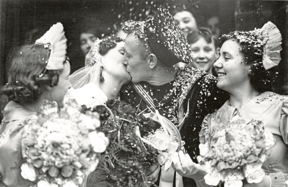 Picture shows: The bride and bridegroom kissing after their wedding today.