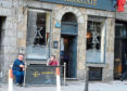 Pub goers drinking outside at the Kirkgate bar in Aberdeen. 
Picture by Jim Irvine.