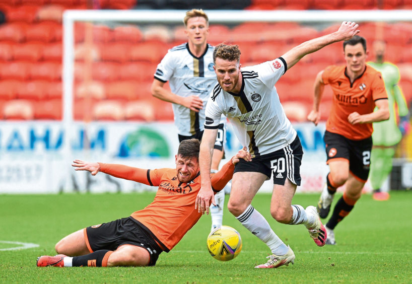 Marley Watkins (R) and Dundee United's Calum Butcher.