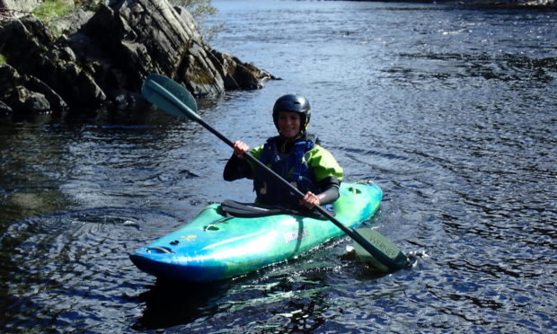 Enjoying a kayaking session on the River Spey.