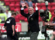 Aberdeen Manager Ebbe Skovdahl cheers on the fans before his first game in charge against Celtic in August 1999.