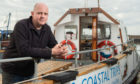 Furious recreation boat owner Barry Paskins with his boat.