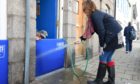 Residents installing a flood gate at their home for the first time in Barclay Street Stonehaven ahead of a forecast of possible flooding tomorrow. Picture by Paul Glendell